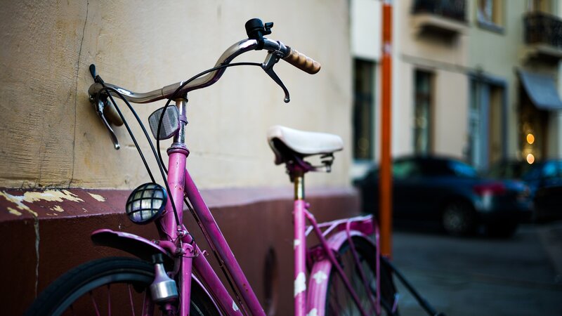 pink bicycle on city street