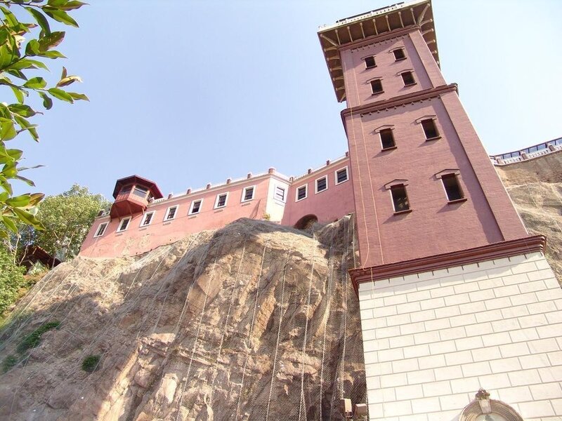 Pink building on a cliff