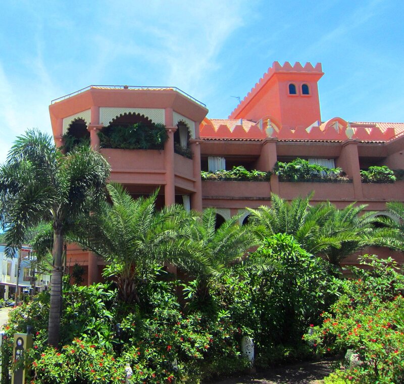 Pink Building with Palm Trees