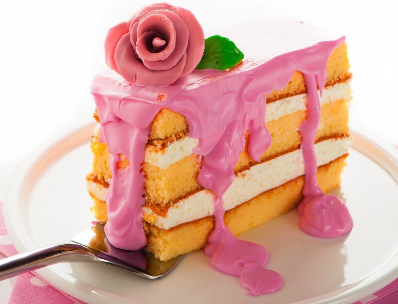 Pink cake slice with rose