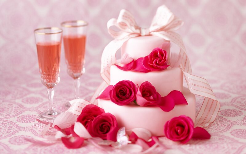 Pink cake with roses and champagne