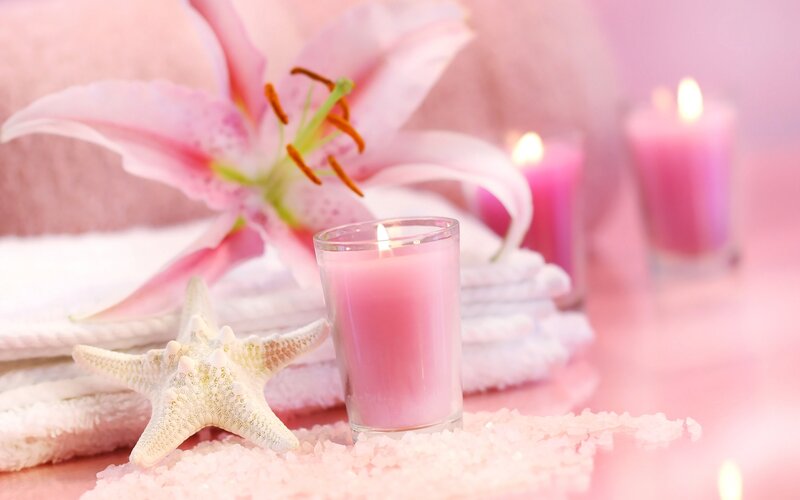 Pink candle and lily flower