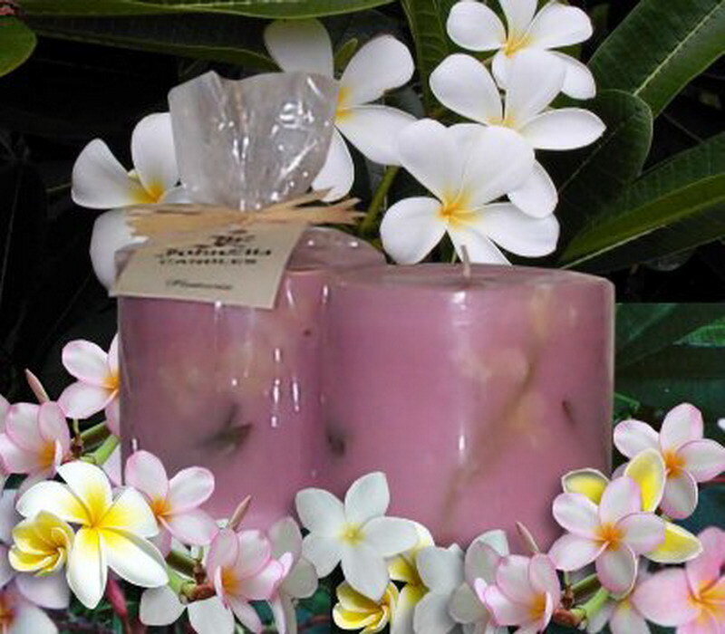 pink candles with frangipani flowers