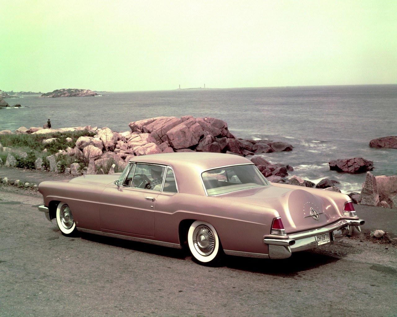 Pink car by the sea