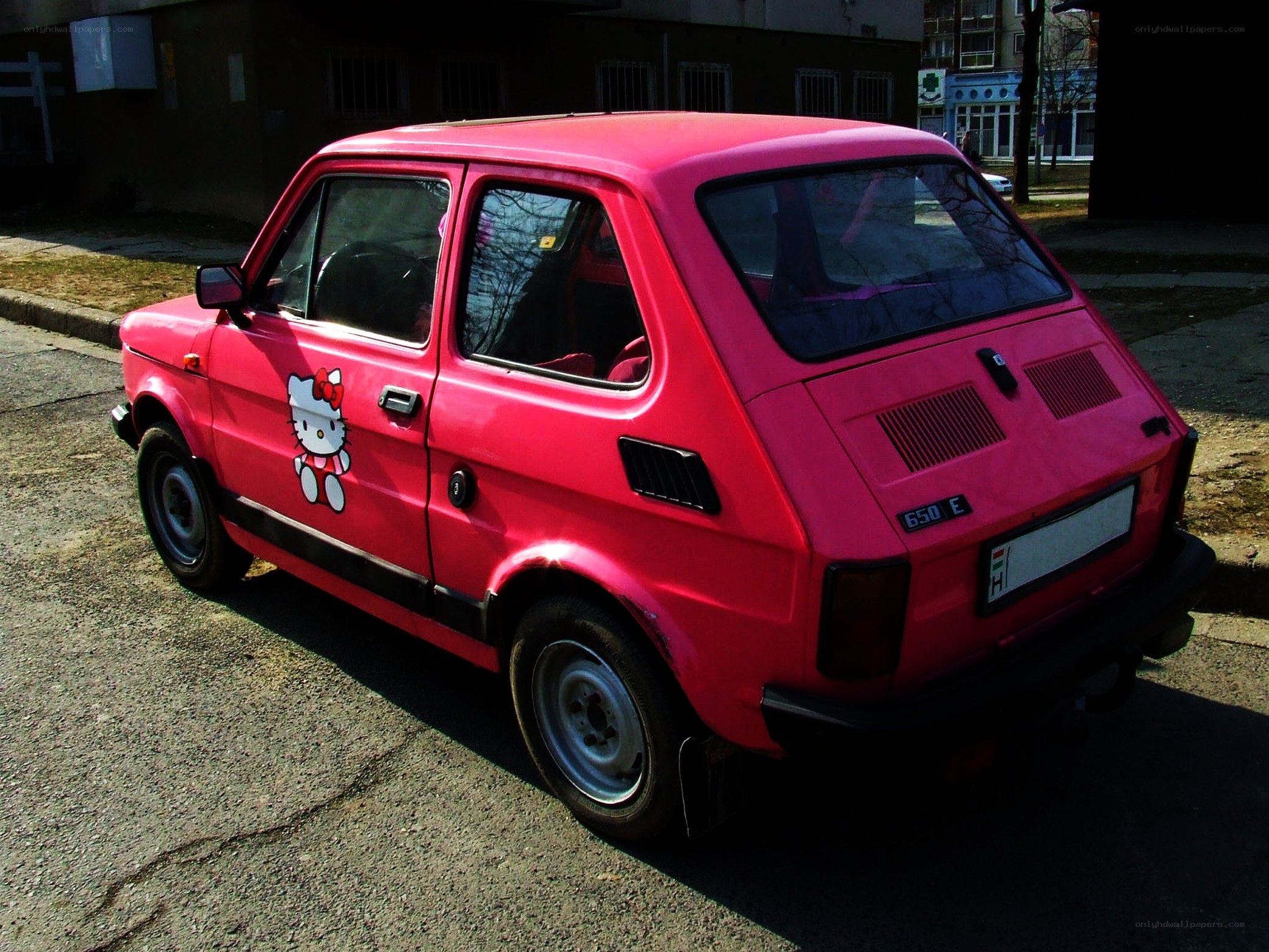 Pink car with Hello Kitty decal