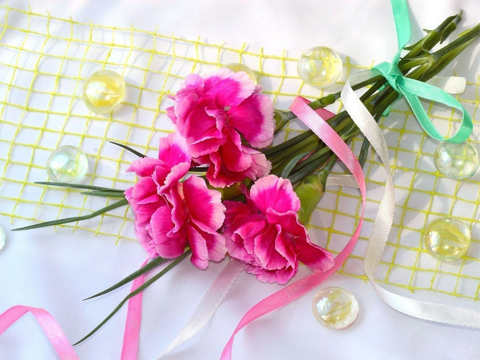Pink carnations with ribbons