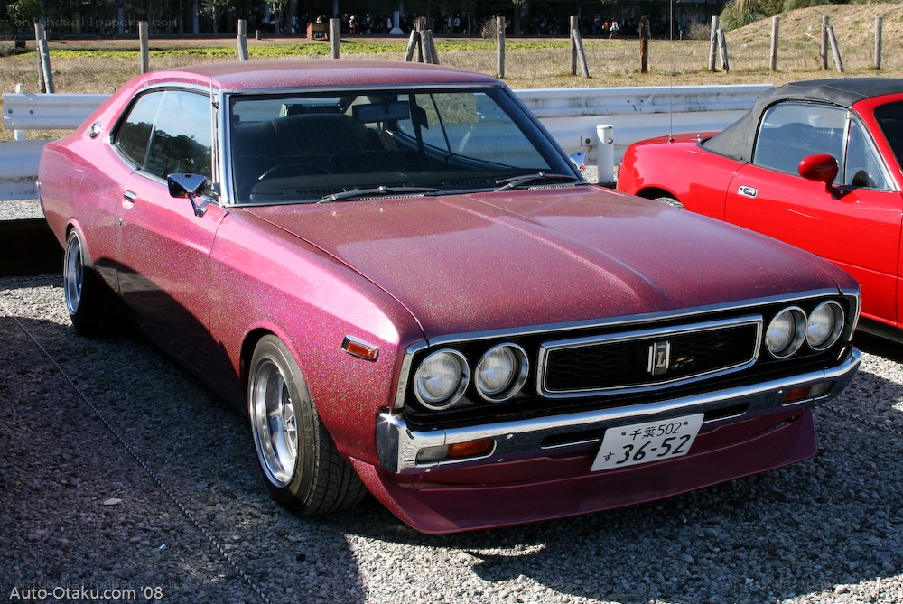 Pink classic car at show