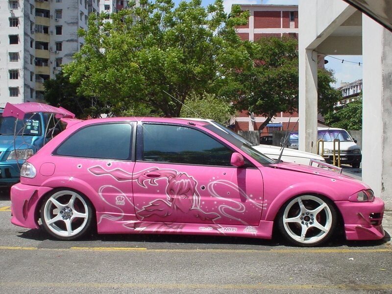 pink custom car with anime art