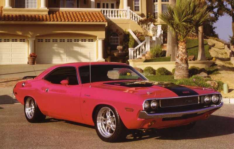 Pink Dodge Challenger in driveway