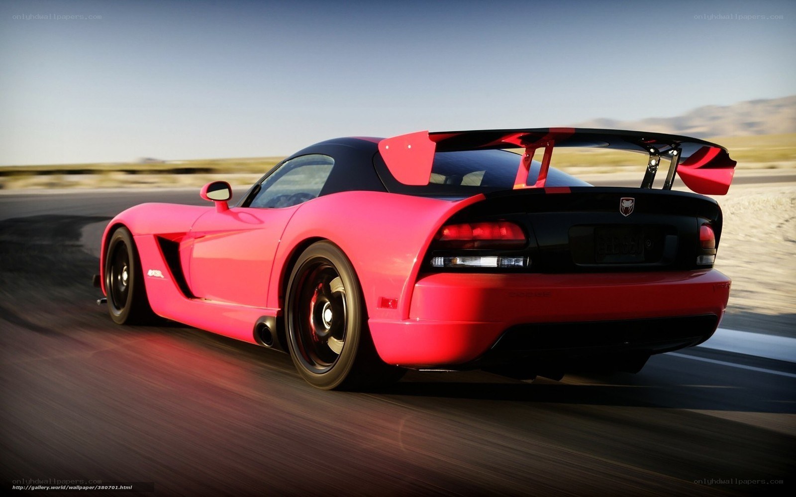 pink dodge viper in motion