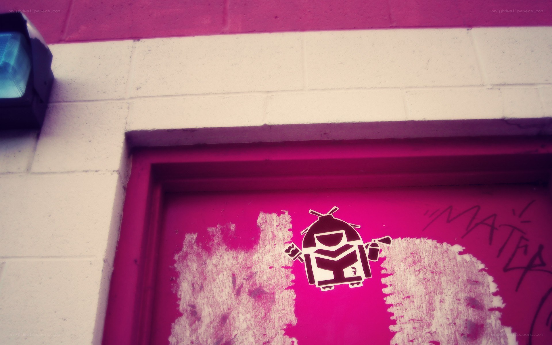 pink door with robot sticker