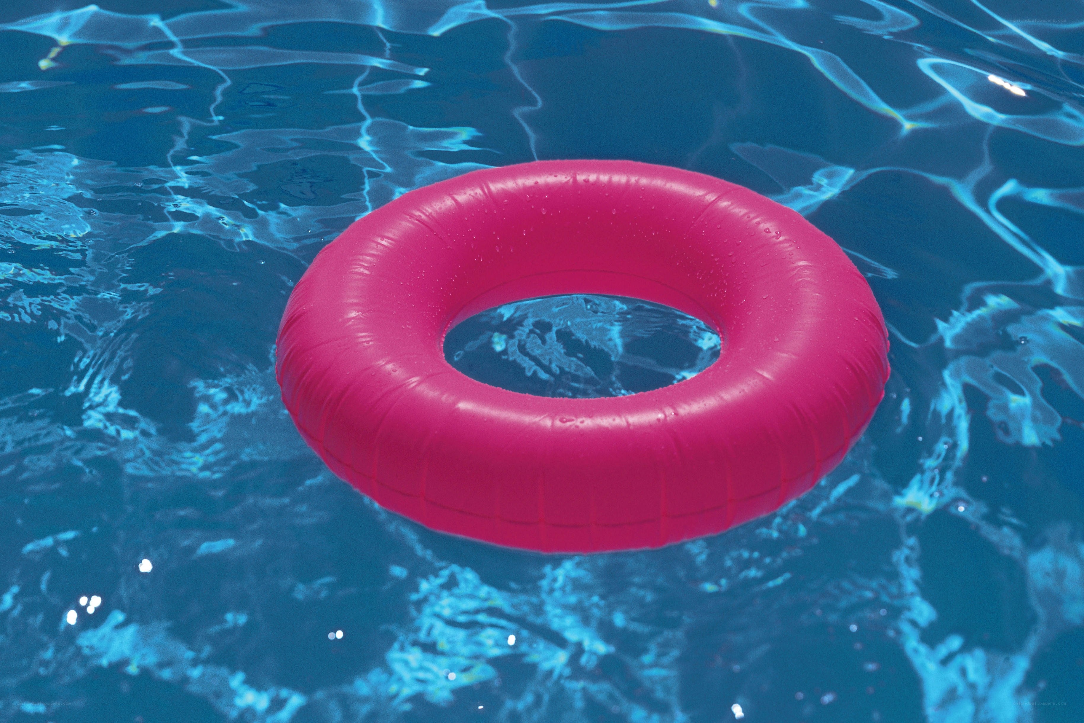 Pink float in pool water