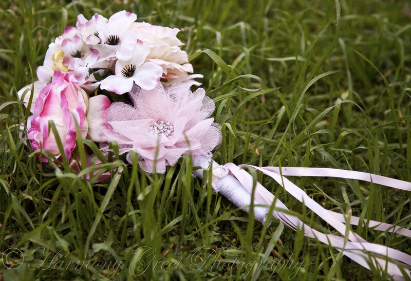 Pink floral bouquet on grass