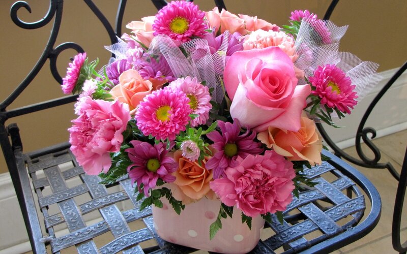 Pink flower bouquet on chair