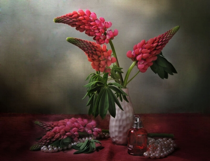 Pink flowers and perfume still life
