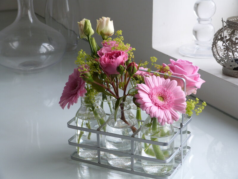 Pink Flowers in Glass Bottles
