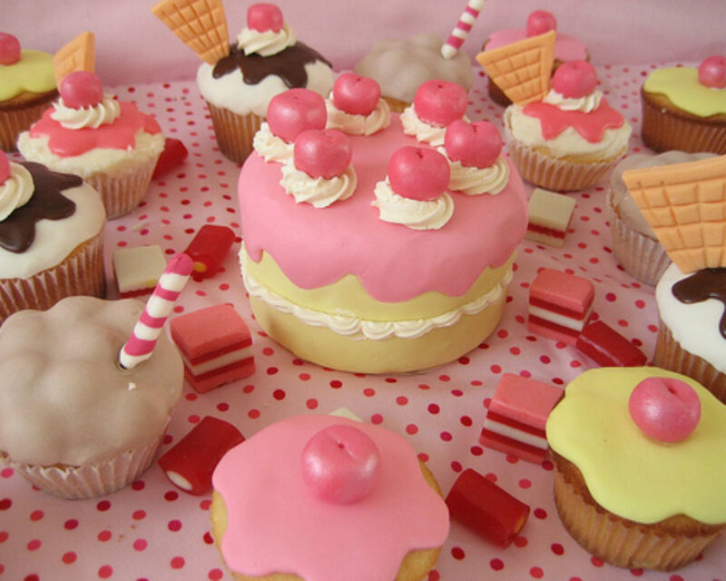 Pink-frosted Cake and Cupcakes