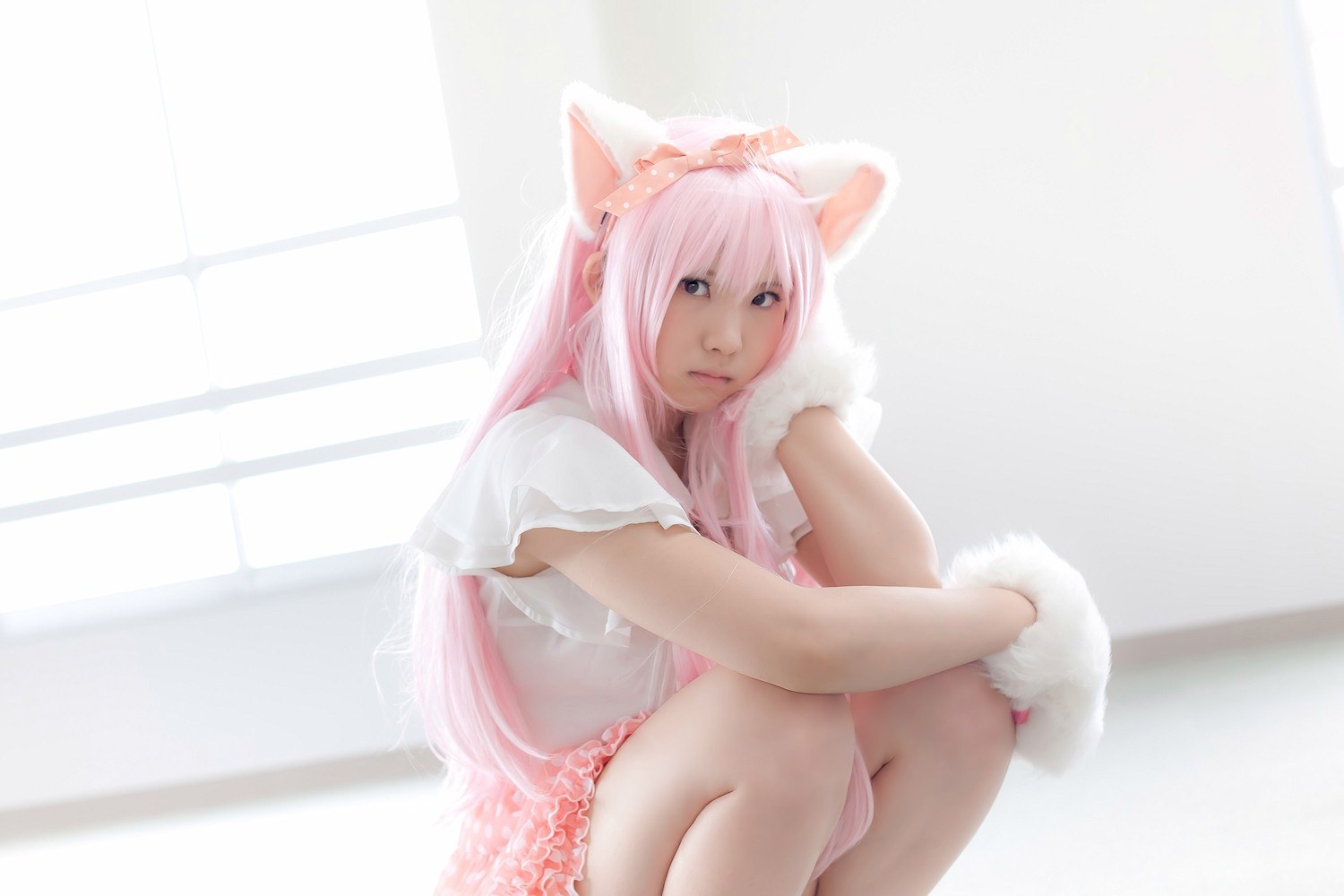 pink-haired cosplayer with cat ears