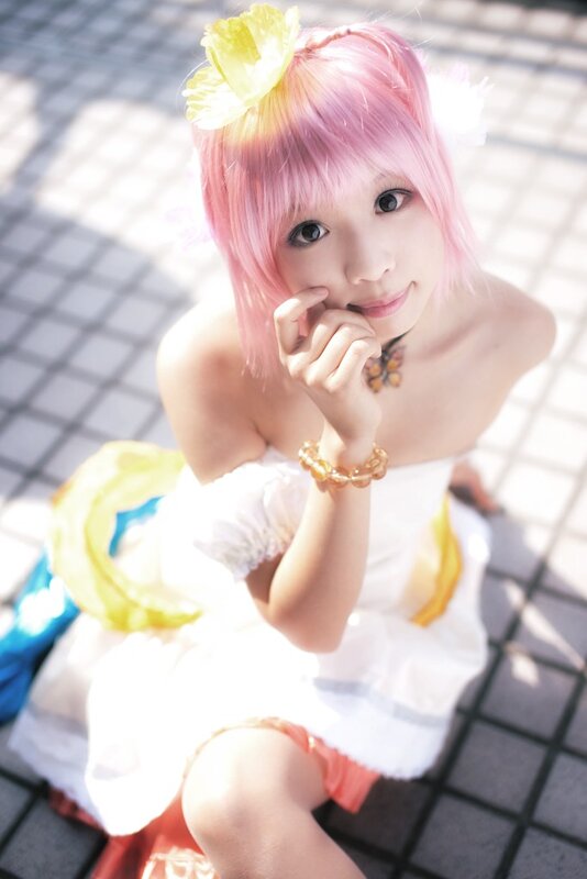pink-haired cosplayer with flower