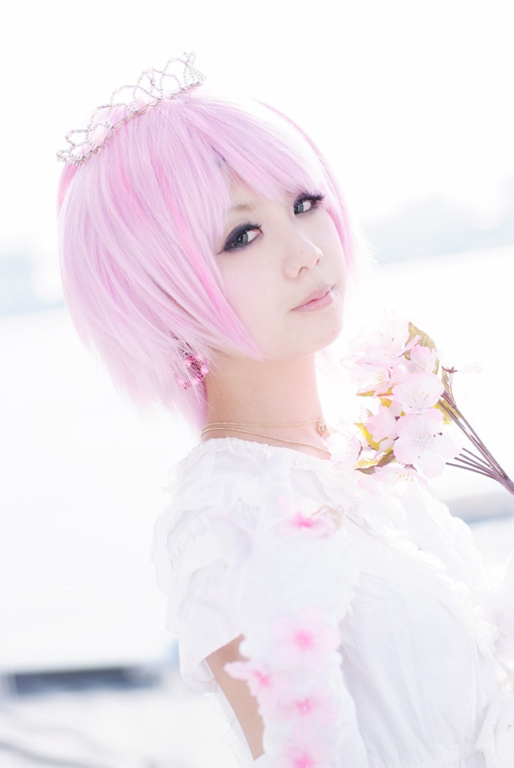 pink-haired cosplayer with flowers