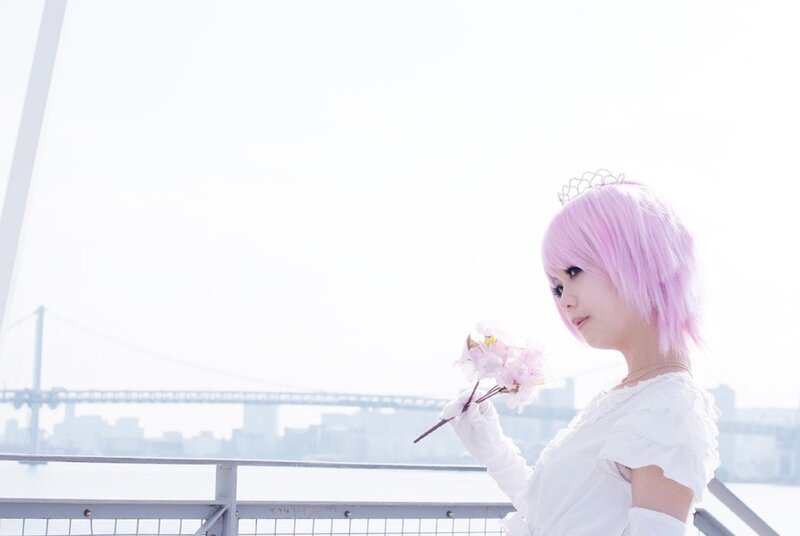pink-haired cosplayer with flowers