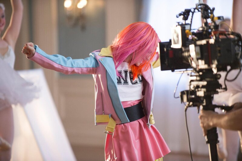 Pink-haired dancer on set