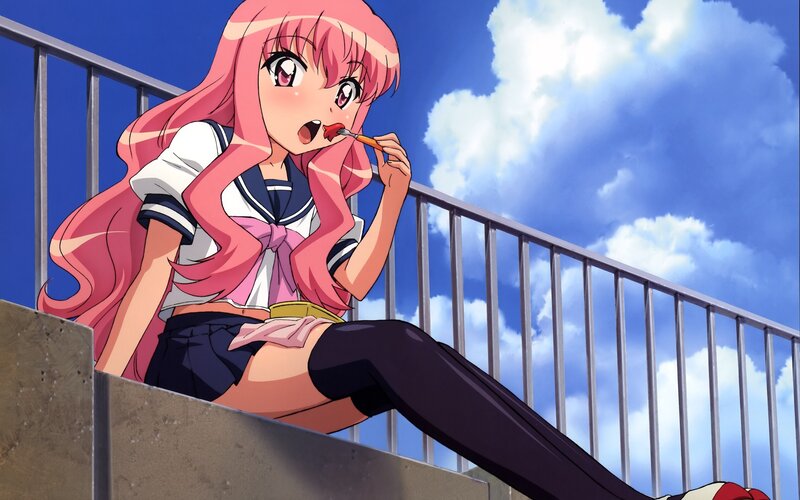 pink-haired girl eating candy