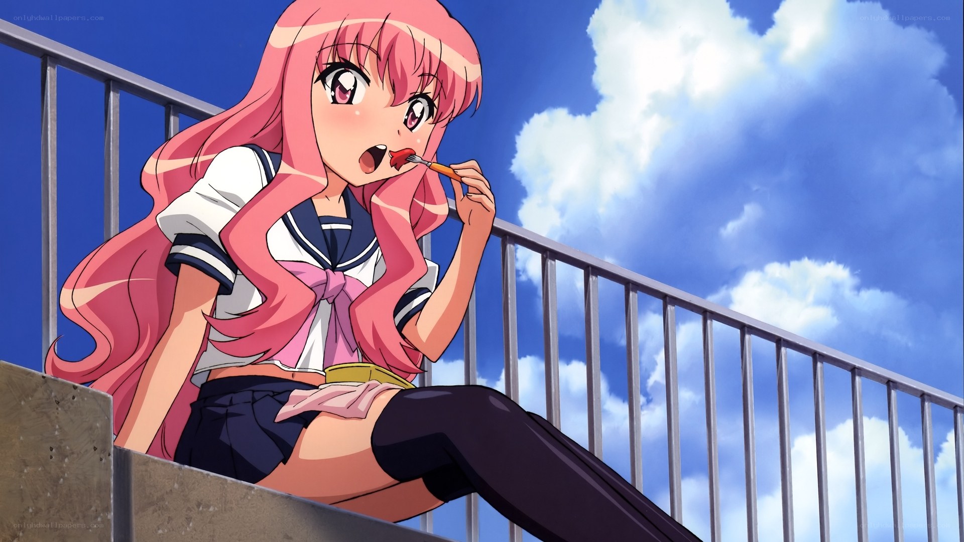 pink-haired girl eating candy
