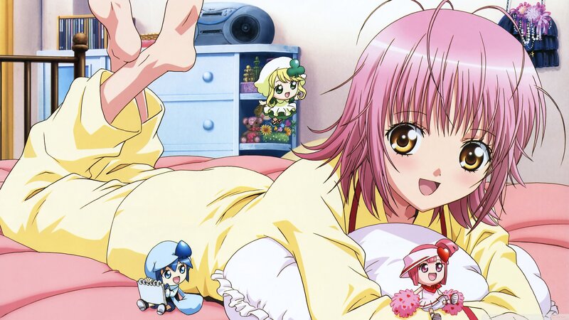 Pink-haired girl in bed with dolls