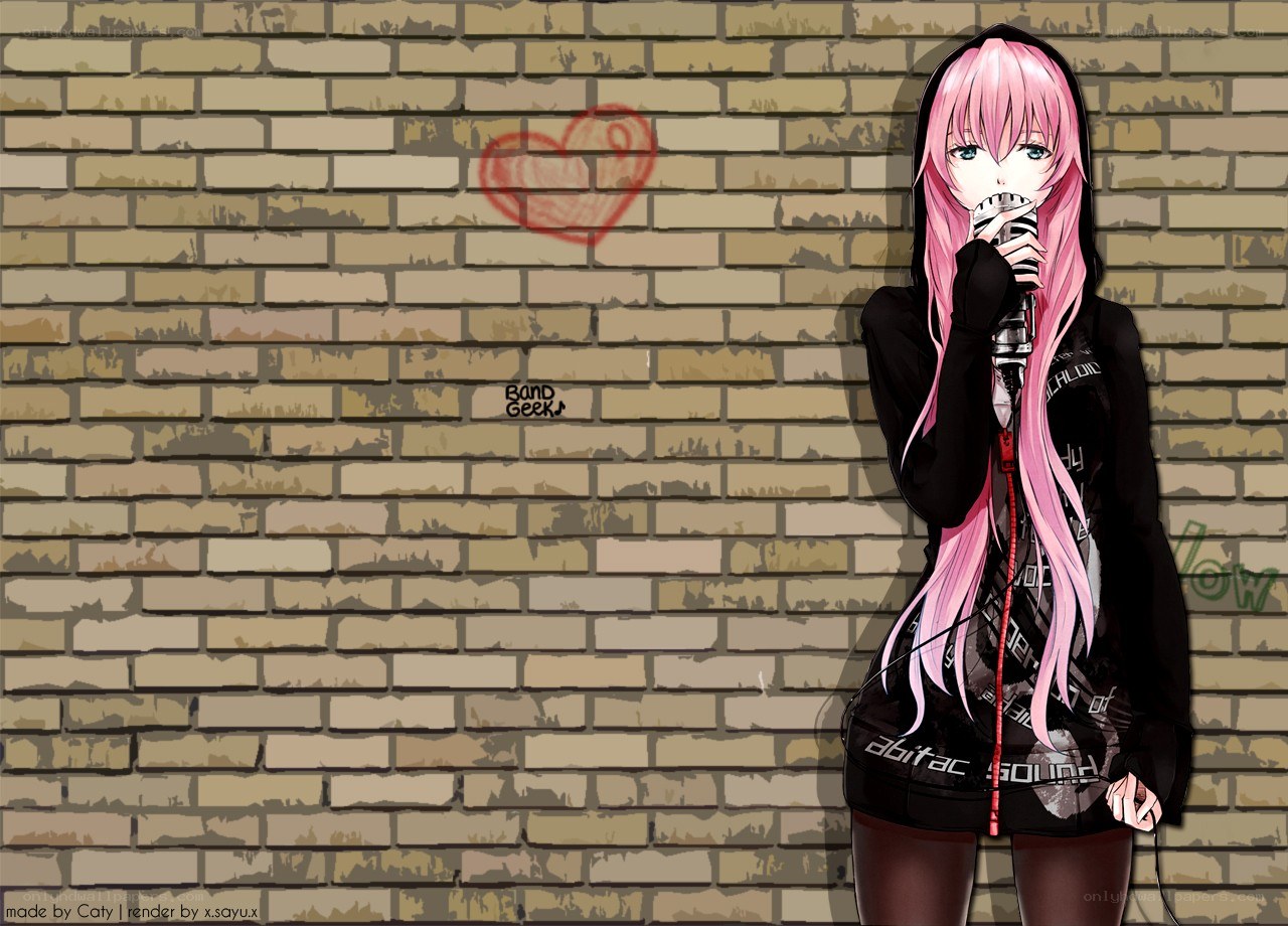 Pink-haired singer against brick wall