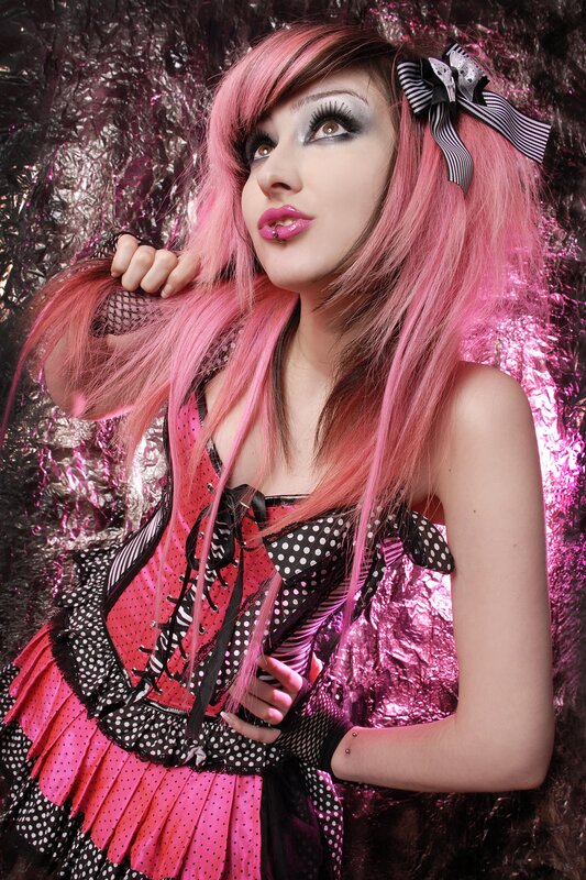 pink-haired woman in gothic outfit