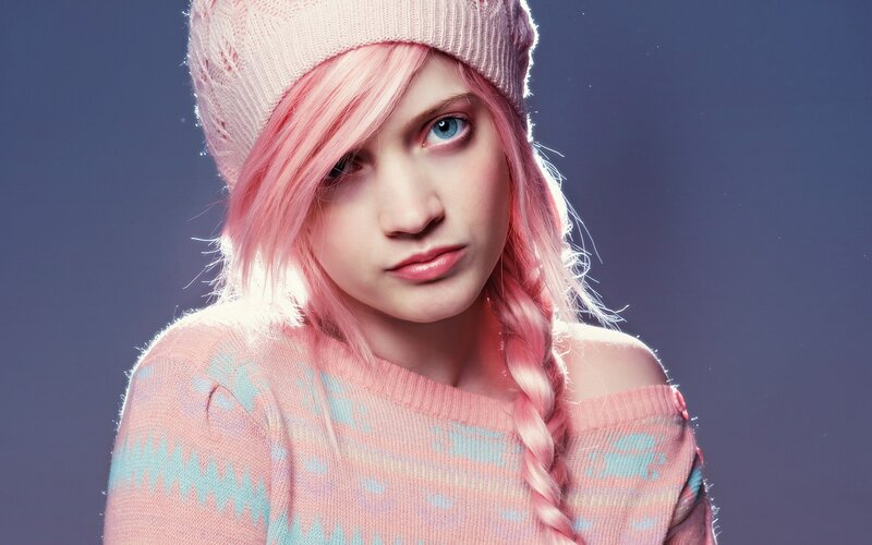 pink-haired woman in knitwear