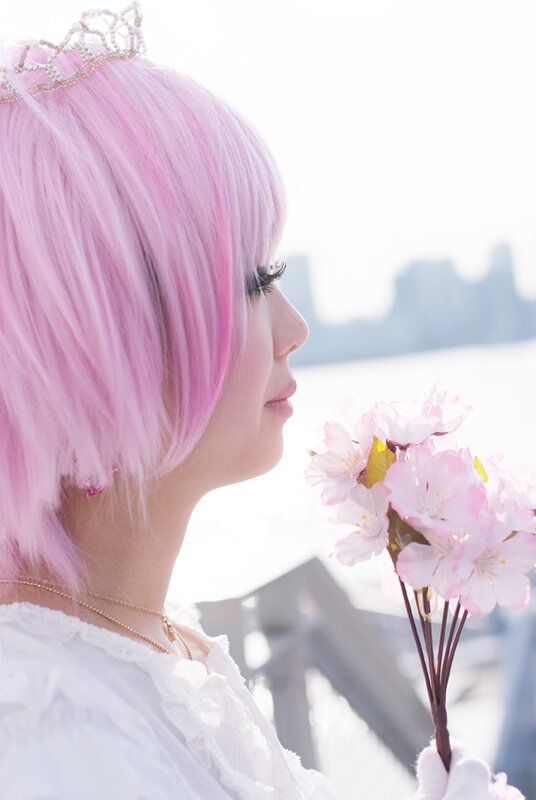 Pink-haired woman with flowers