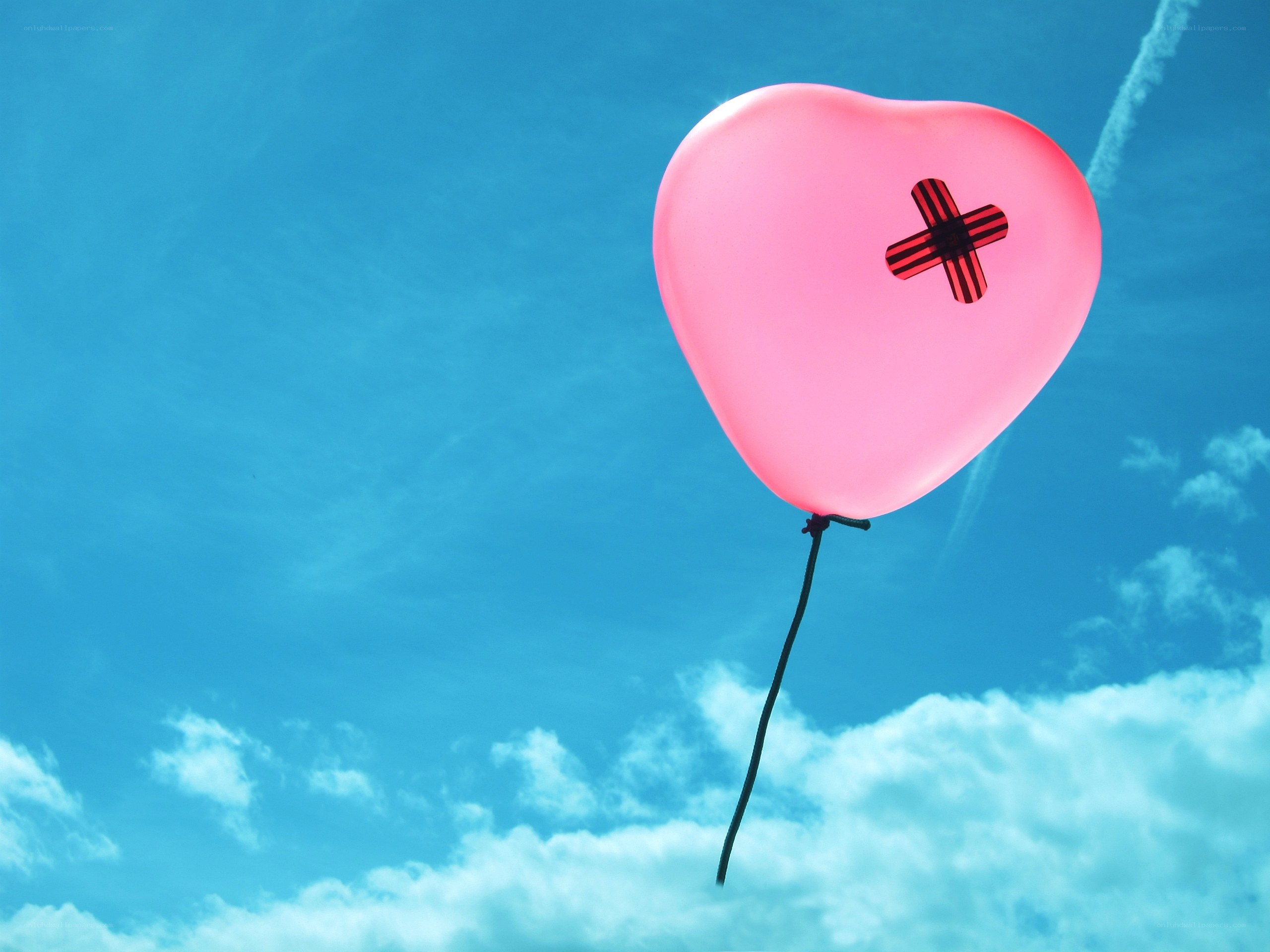 Pink heart balloon with bandage