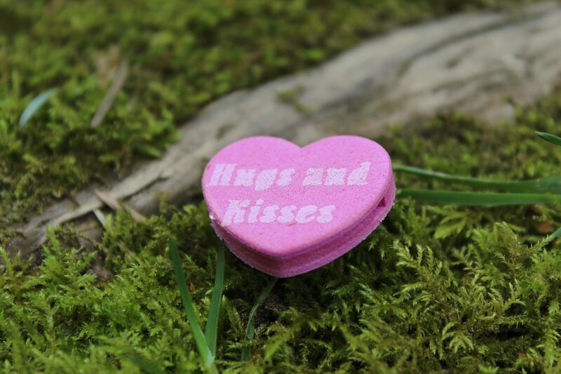Pink heart with hugs and kisses