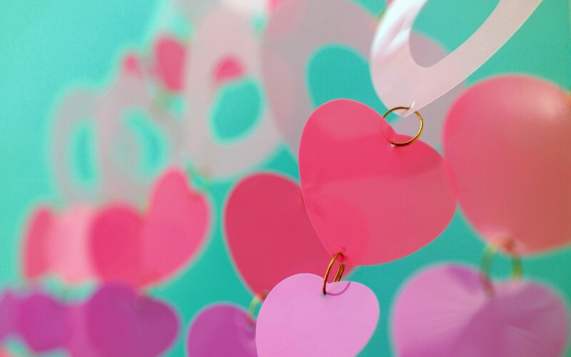 Pink hearts hanging in air