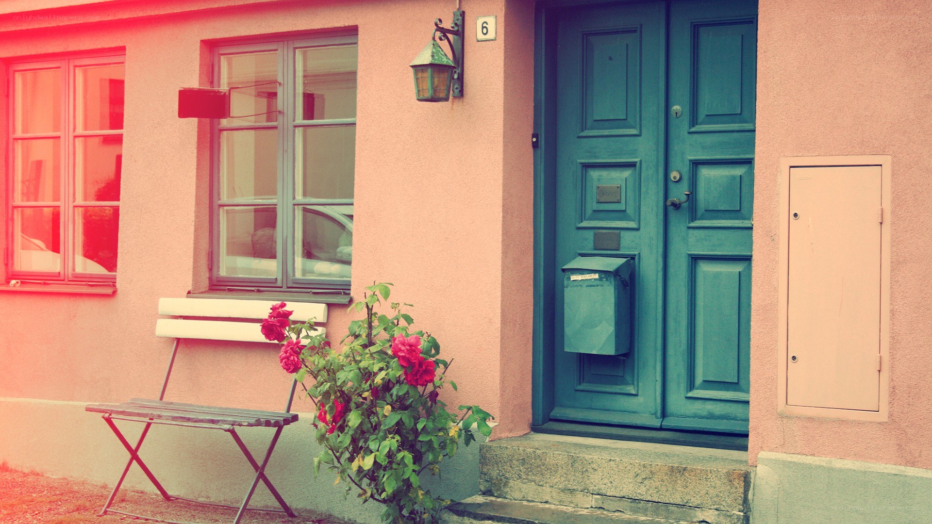 pink house with blue door