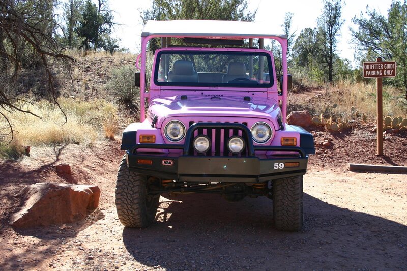 Pink Jeep on a Dirt Road