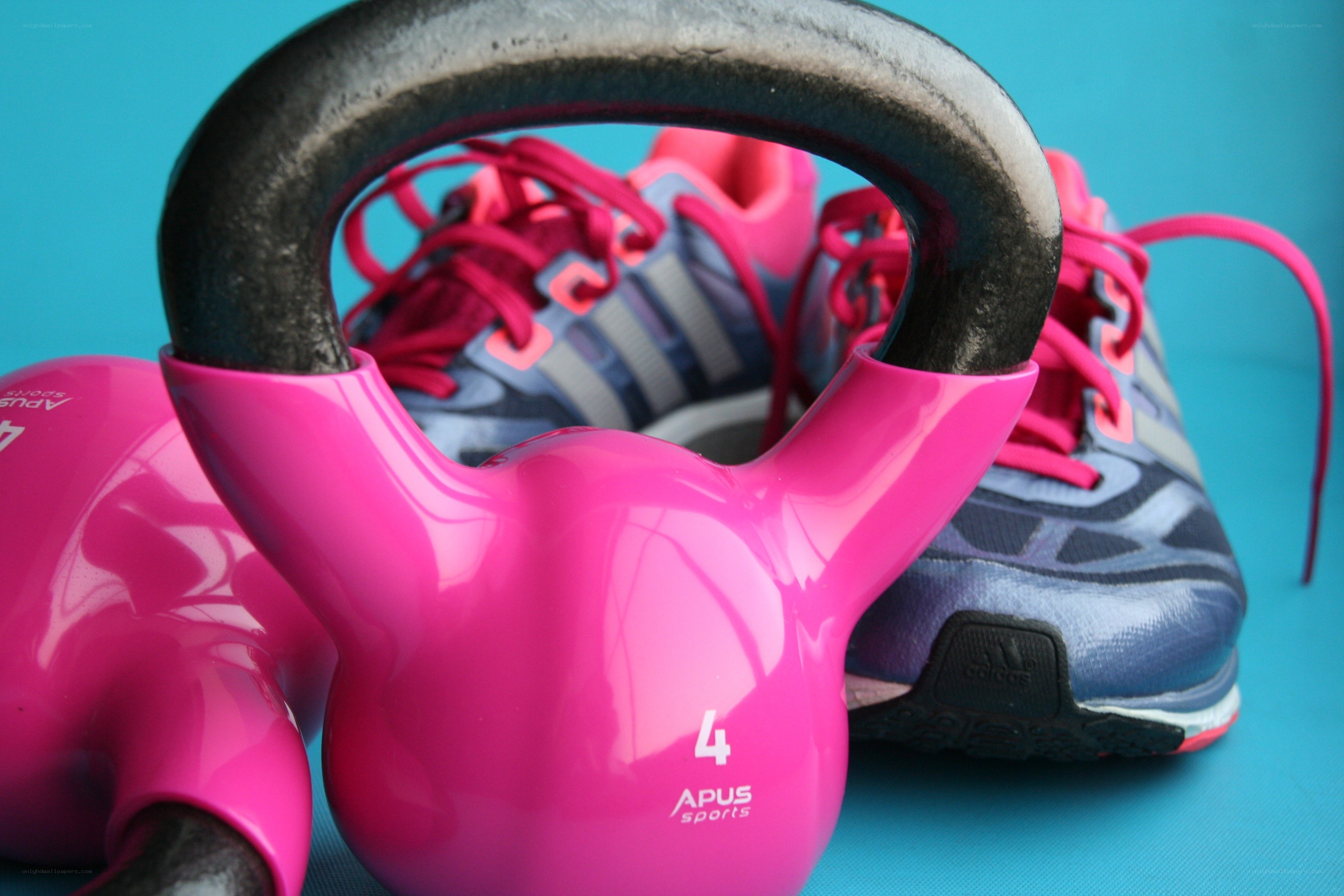 Pink kettlebells and running shoes