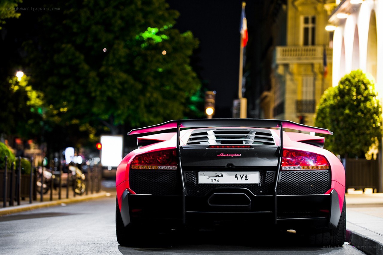 Pink Lamborghini at night