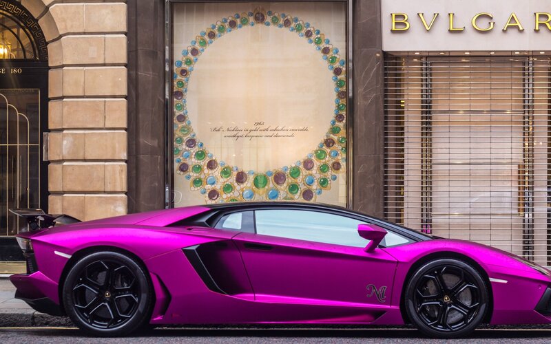 Pink Lamborghini in front of Bulgari