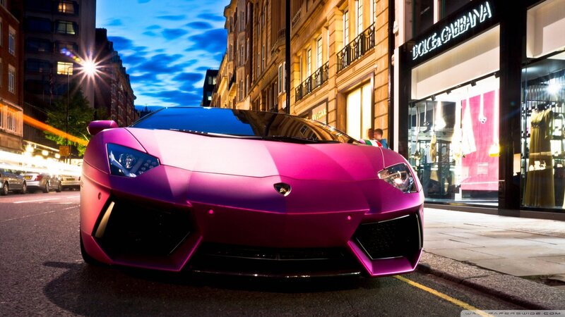 pink Lamborghini on city street