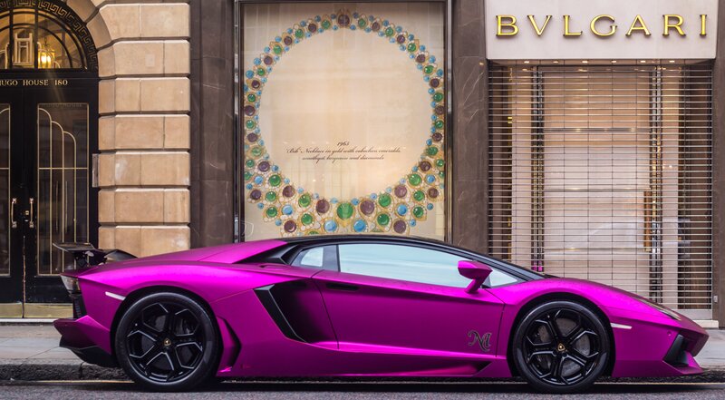 Pink Lamborghini on city street