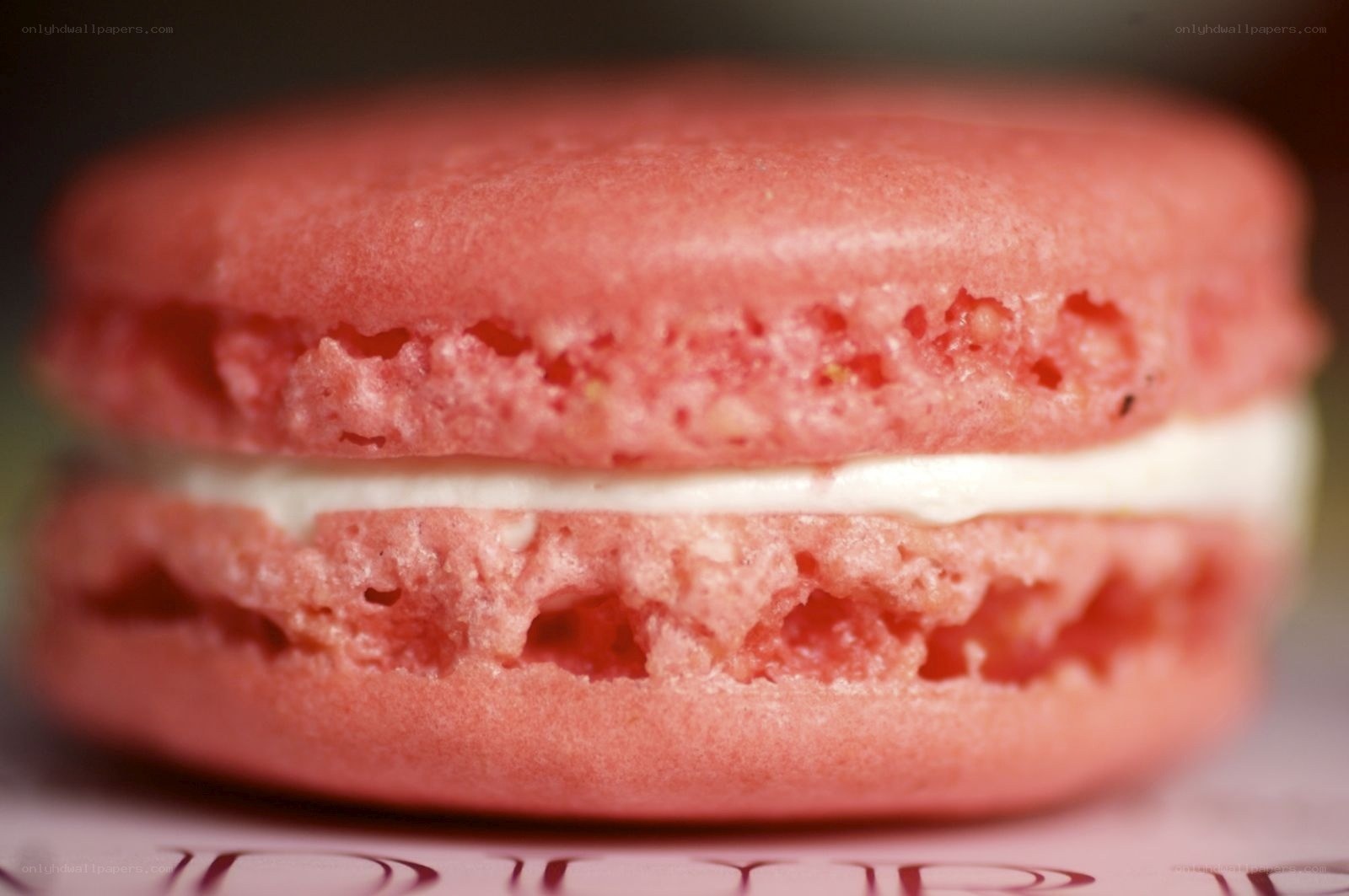 pink macaron with cream filling