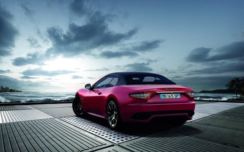 Pink Maserati on a pier