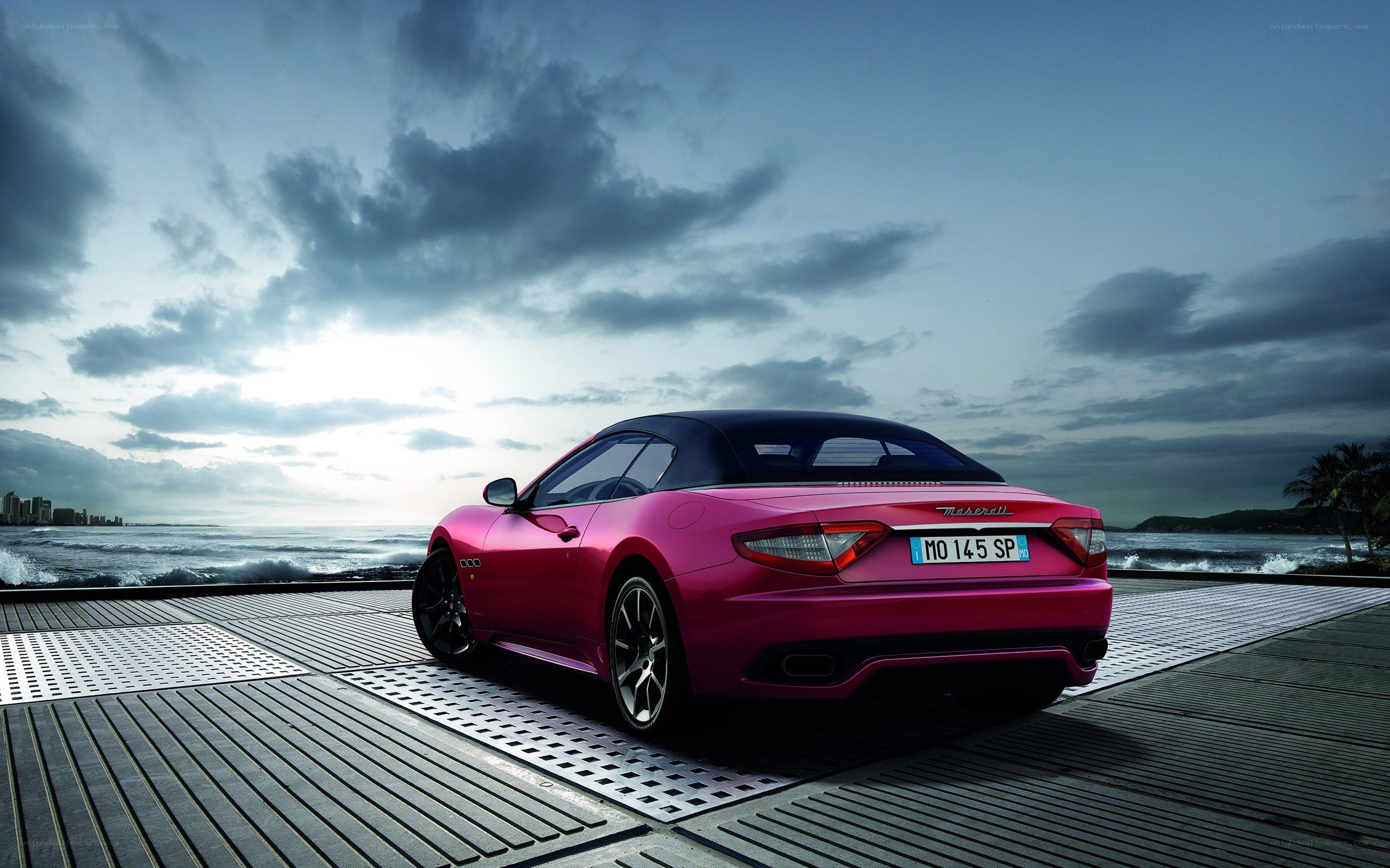 Pink Maserati on a pier