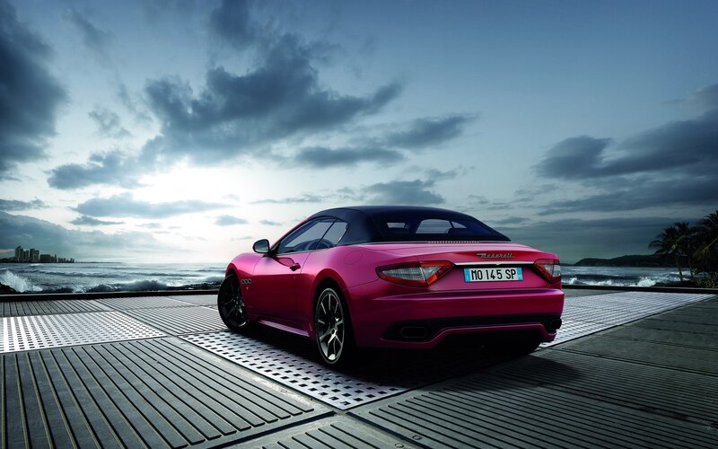 Pink Maserati on seaside deck