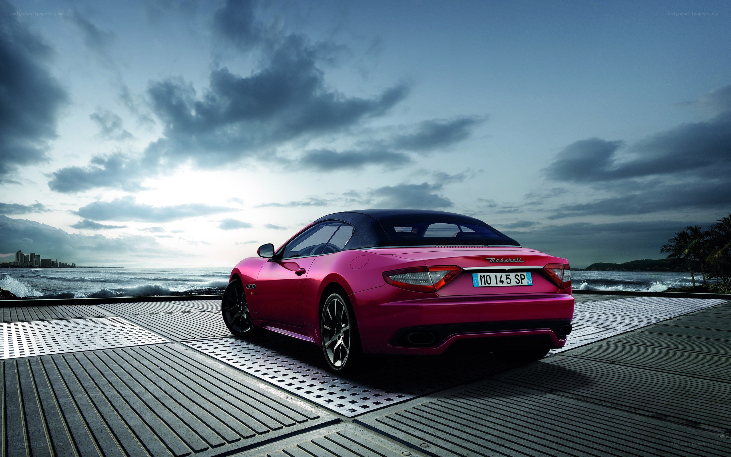 Pink Maserati on seaside deck