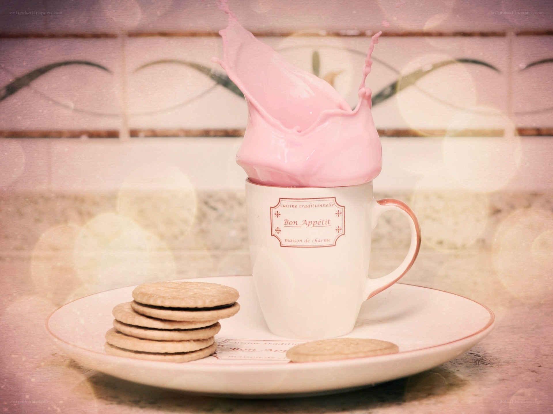 Pink milk splash in a cup