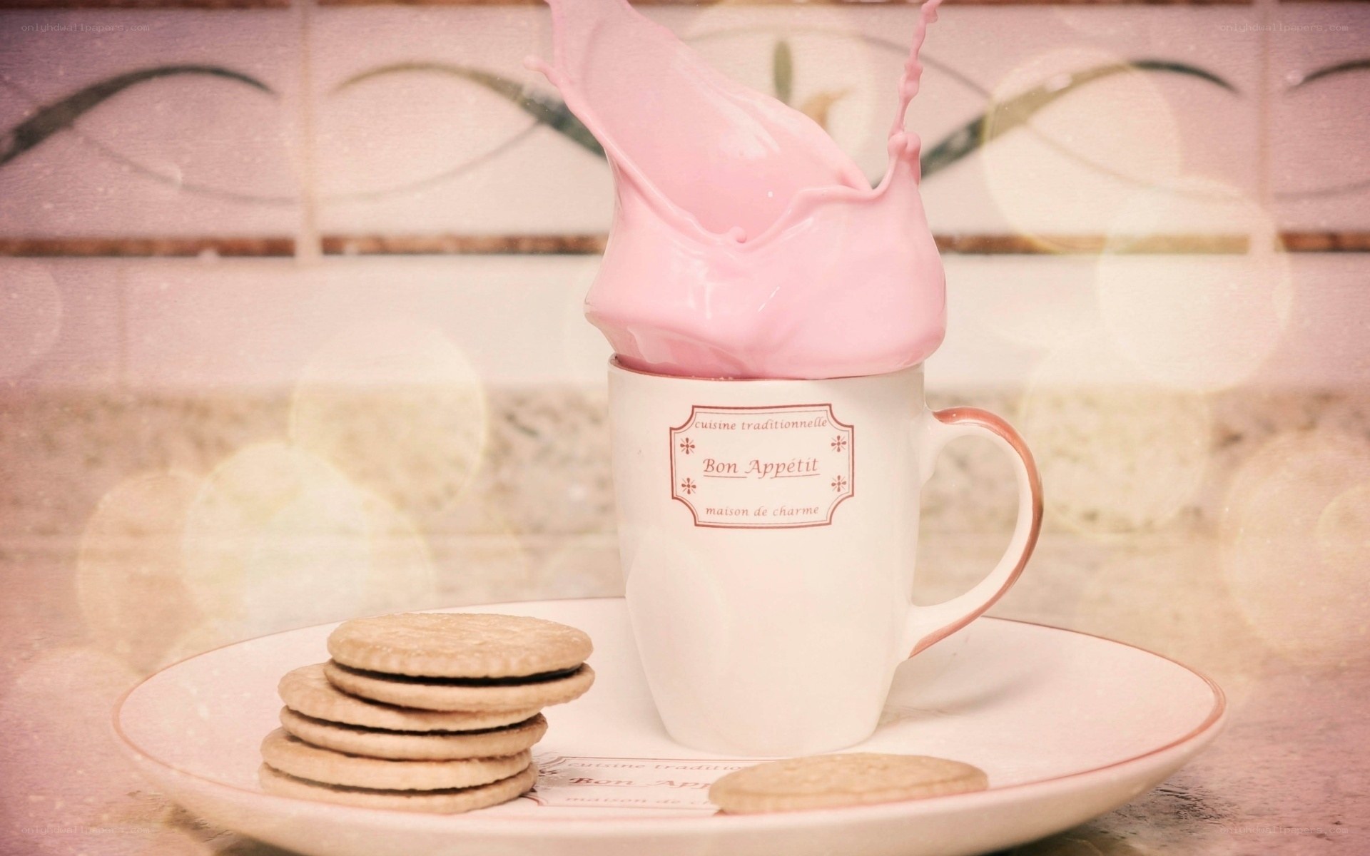 Pink milk splash in a mug